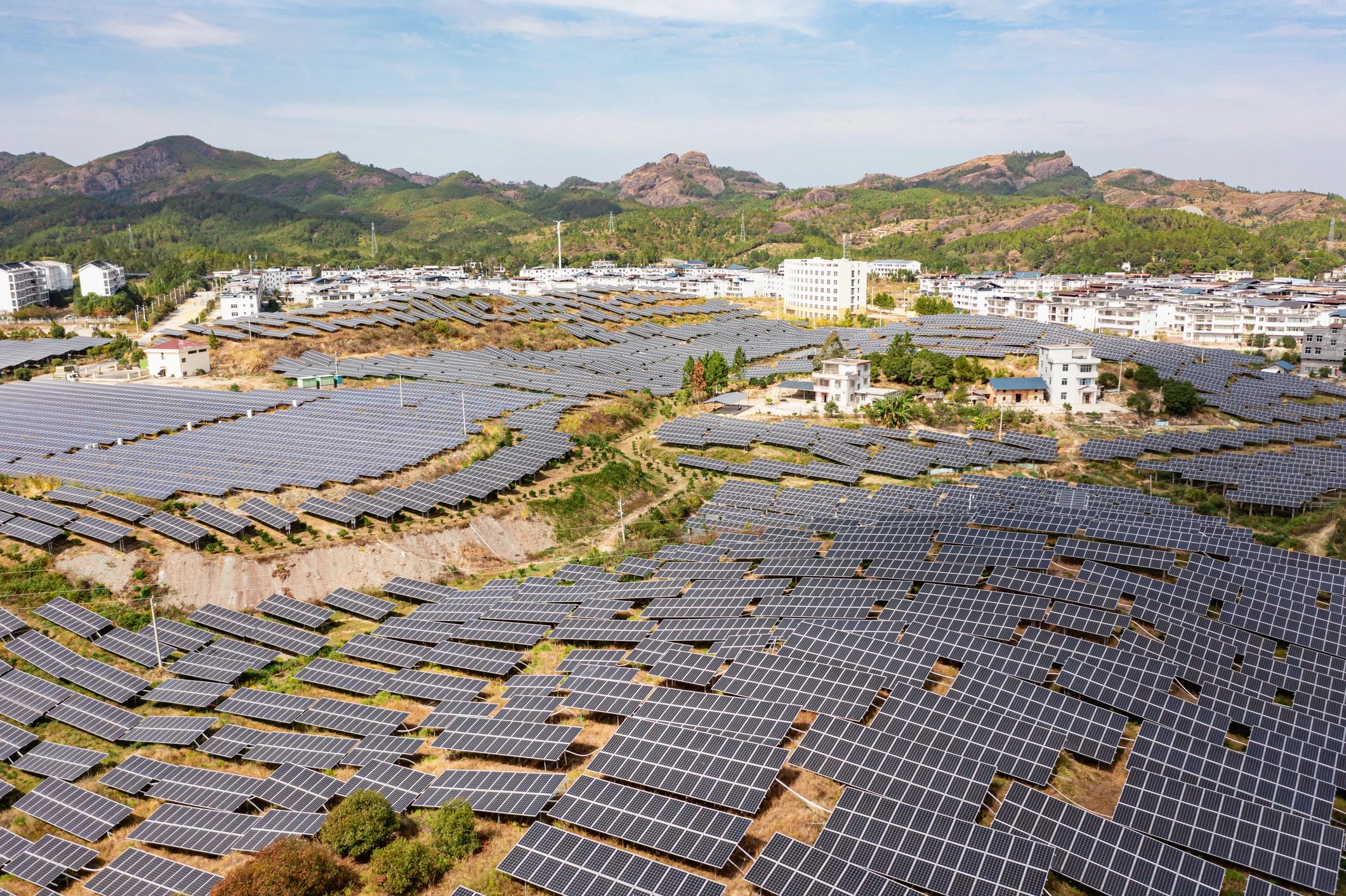 Aerial photography of large solar power plants in modern towns