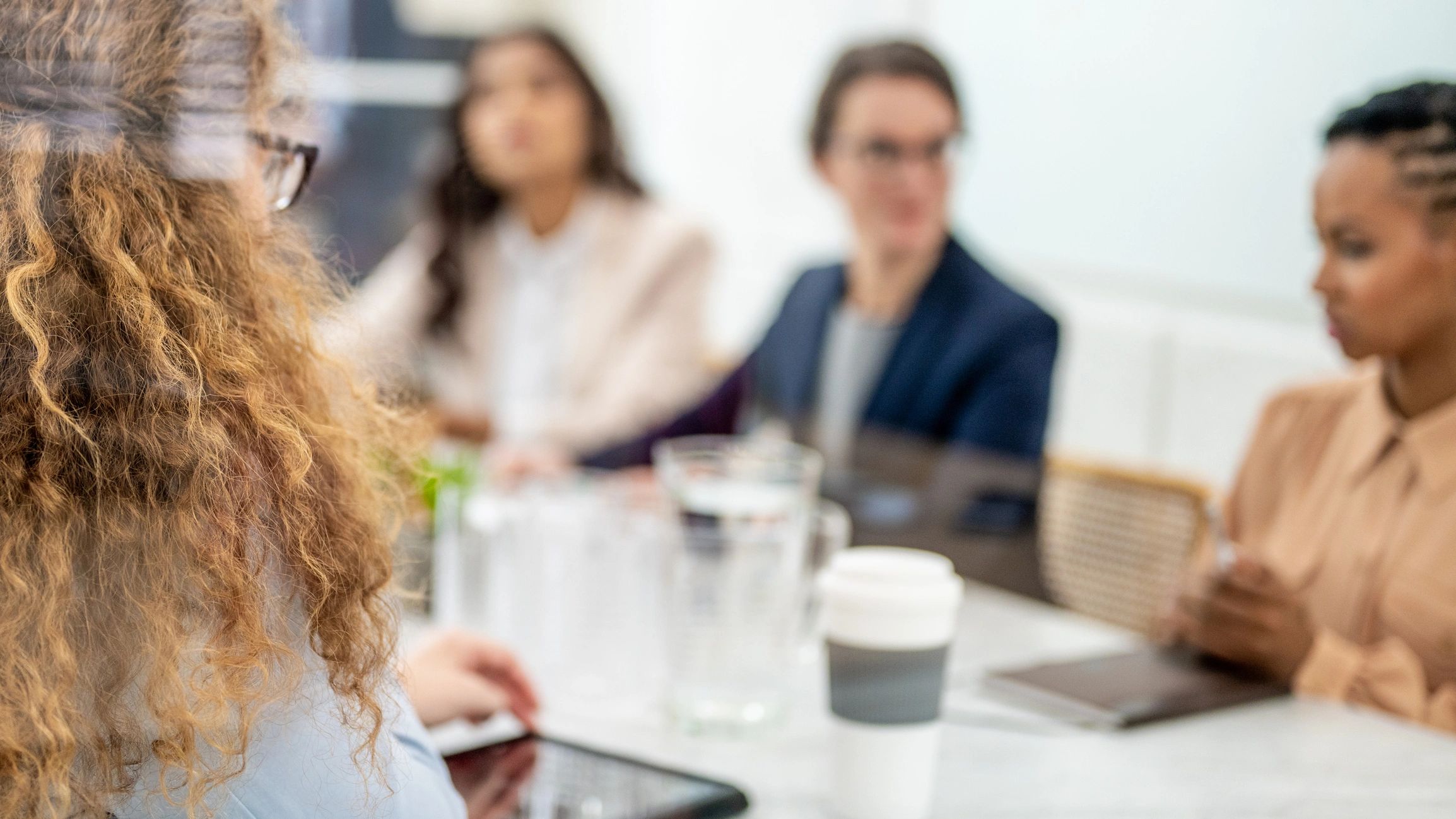 Businesswomen brainstorming in morning briefing