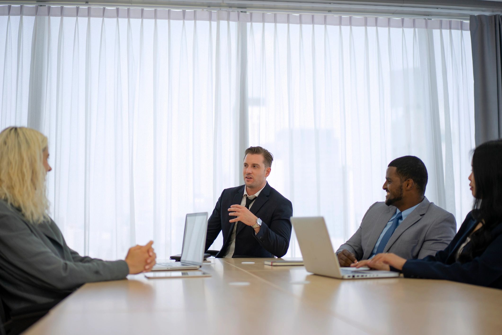 White collar workers meeting in a conference room