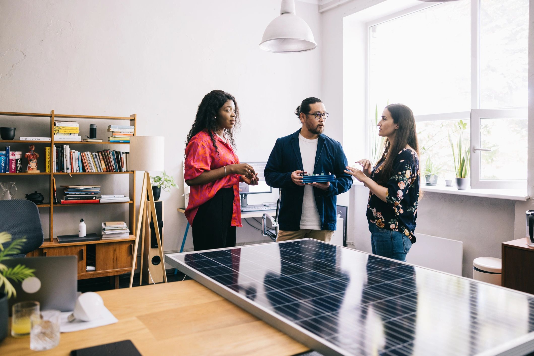 Renewable energy professionals reviewing plans together